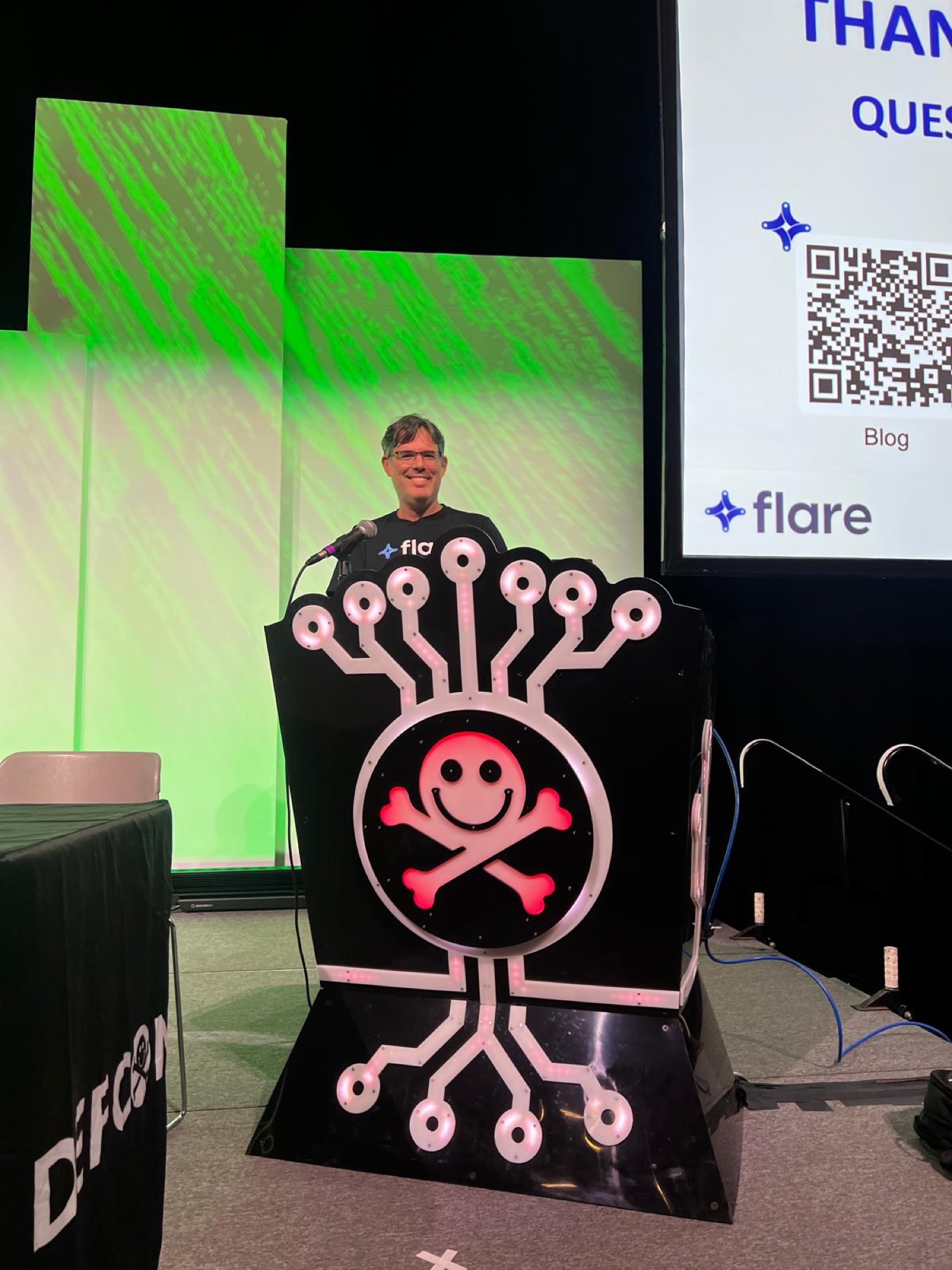 Assaf Morag at the DEF CON 34 podium